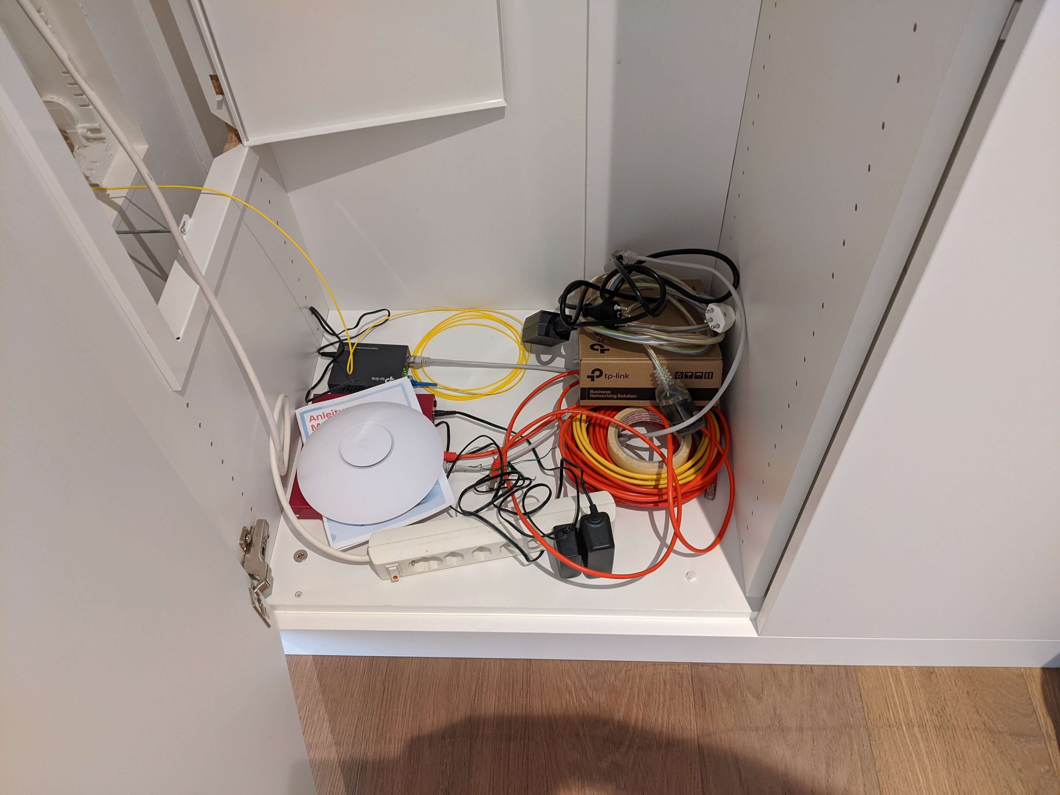 network devices with awful cable management on the floor